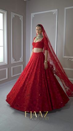 Make a statement with this enchanting deep red net-silk lehenga set. Beautifully ornamented with matching sequins, stones, and studs, this set will make you feel like a queen. The sweetheart neckline bedecked blouse and sheer net encrusted dupatta compliments the ball pleated skirt gracefully, creating an elegant and luxurious ensemble.  Available at BIBI London. To book your appointment, call us at 07931 999111. Plain Red Lehenga Indian Outfits, Red Net Lehenga Bridal, Plain Red Lehenga Bridal, Indian Bride Red Lehenga, Red Lehnga Bridal Lehenga, Red Bridal Lehenga Indian, Red Lehenga Bride, Indian Wedding Lehenga Bridal, Red Lehenga Designs