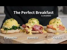 three sandwiches with ham, cheese and hollandaise on them sitting on a cutting board