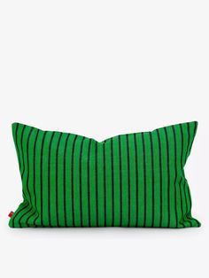 a green and black striped pillow on a white background