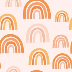 an orange and white wallpaper with rainbows on it