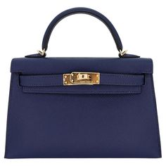 Brand: Hermès Style: Kelly II Sellier Mini Size: 20cm Color: Navy Material: Epsom Leather Hardware: Gold Hardware(GHW) Dimensions: 7.5" W x 4.5" H x 2.25" D Handle Drop: 3.25" Strap Drop: 18.5"