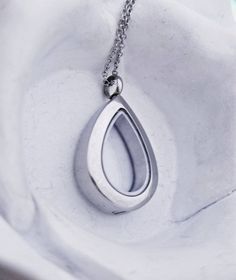 This teardrop urn necklace can be filled with your loved one's ashes so you can carry them with you wherever you go. The necklace is made of glass and stainless steel. It is hypoallergenicand will never tarnish. The pendant measures 1.25" and the chain is 18".Each order includes a funnel, a micro screw driver, and urn filling instructions. Cremation Necklace Glass Cremation Locket Teardrop Urn Necklace Cremation Jewelry Clear Urn Jewelry Fillable Jewelry Memorial Gift Ashes Pet Loss Sand Necklace, Cremation Ring, Ashes Necklace, Cremation Necklaces, Urn Pendant, Angel Jewelry, Urn Jewelry, Urn Necklace, Urn Necklaces