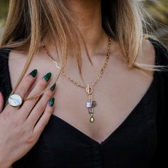 -18k gold plated short front toggle necklace with multi-color charms - Pairs beautifully with the Jane Charm Necklace and the Ellery Earrings - Measures 17" -Handmade -Please note that our brand uses natural semi-precious stones--each piece has a unique texture, shine, and color Gold-tone Toggle Necklace With Gold Chain, Gold-tone Metal Toggle Necklace With Chain, Gold-tone Brass Toggle Necklace With Adjustable Chain, Artisan Turquoise Multi-stone Necklace, Artisan Blue Turquoise Multi-stone Necklace, Toggle Necklace, Green Amethyst, Blue Topaz, Semiprecious Stones