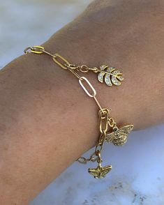 This Charm Bracelet is made with gold filled paperclip chain with a lobster clasp and includes a pretty gold filled CZ heart charm. Can be worn as is, or add as many charms as you wish. Chain length is 7 1/2" and completely adjustable. Check out additional charms here on the website Cheap Charm Bracelet With Lobster Clasp, Luxury Adjustable Charm Bracelet With Lobster Clasp, Cheap Gold Dangle Charm Bracelet, Luxury Gold Plated Charm Bracelet Gift, Cheap Bohemian Charm Bracelets With Lobster Clasp, Gold Dainty Paperclip Bracelet With Lobster Clasp, Dainty Gold Paperclip Bracelet With Lobster Clasp, Gold Charm Bracelet With Paperclip Chain For Gift, Gold-plated Paperclip Bracelet With Lobster Clasp As Gift