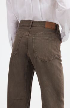 Anchored at the waist with an oversized fit, these barrel-leg, nonstretch jeans have darts at the knees for an articulated curved look. Zip fly with button closure Five-pocket style 100% cotton Machine wash, tumble dry Imported Brown Relaxed Fit Straight Leg Jeans, Brown Relaxed Fit Jeans With Tapered Leg, Brown Relaxed Fit Tapered Leg Jeans, Brown Tapered Leg Jeans With Belt Loops, Brown Washed Wide Leg Jeans, Brown Wide Leg Washed Jeans, Brown Tapered Leg Jeans With Five Pockets, Leg Jeans, Madewell