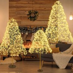 a living room decorated with christmas trees and lights