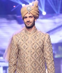 <p>High quality organza turban in pale gold color<br />Pre tied<br />Long tail</p> <p><strong>Additional Accessories:</strong> Jewellery / Embroidery Price: US$50</p> Traditional Fitted Turban For Party, Gold Sherwani With Intricate Embroidery For Party, Gold Sherwani For Eid Party, Party Gold Sherwani With Intricate Embroidery, Fitted Gold Traditional Wear With Tilla, Traditional Sherwani With Gold Embroidery For Party, Embroidered Gold Bandhgala For Parties, Gold Embroidered Sherwani For Party, Gold Sherwani With Resham Embroidery For Party