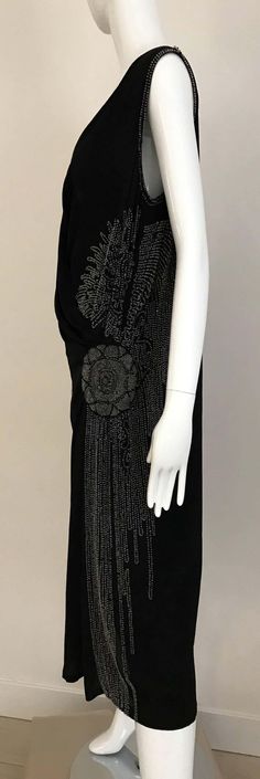 For Sale on 1stDibs - Beautiful Large Size 1920s Black Silk V neck sleeveless flapper dress with clear bugle beads beaded in floral pattern. Fit US SIZE 6/8 Bust : 40 inch Waist: Art Deco Sleeveless Flapper Dress For Evening, Sleeveless Art Deco Flapper Dress For Evening, 1920s Sleeveless Evening Dress, 1920s Style Sleeveless Evening Dress, 1920s Sleeveless Evening Flapper Dress, Beaded Flapper Dress, Bugle Beads, Black Silk, Day Dresses