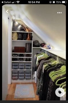 an attic closet is filled with clothes and other items