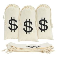 three bags filled with money sitting on top of a white cloth bag next to each other