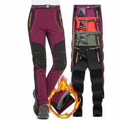 two men's pants with fire on the bottom and one in red, green, orange