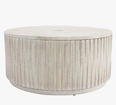 a white round table with wooden slats on top