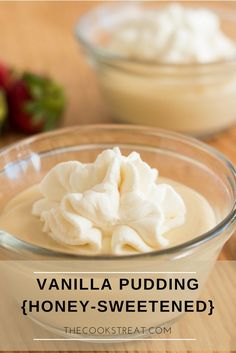 vanilla pudding with honey - sweetened in a glass bowl on a wooden table next to strawberries