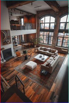 a living room filled with lots of furniture next to large windows and a fire place