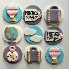 nine decorated cookies are arranged in the shape of different things and words, including luggage