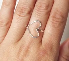 So sweet, this hammered sterling sideways heart ring is perfect for every day. Just love the shape and delicate beauty. :) Choose from all sterling or a gold filled band with a silver heart! Please view the other rings at: http://www.etsy.com/shop/BellatrinaJewelry?section_id=11006644 Please choose from sizes 5-10 and leave message in comment box at checkout. Can be made in gold filled too (as seen in second to last photo)! ** Follow us for updates, contests, and promos. :) IG @bellatrinajewelry Fashion Highlights, Silver Heart Ring, Ring Heart, Gold Filled Ring, Hammered Gold, White Gold Jewelry, Love Ring, Ring Silver, Silver Heart