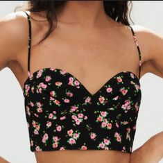 Embrace Your Feminine Side With This Stunning Zara Floral Bustier Corset Crop Top In A Trendy Black And Pink Color Combination. The Top Features A Beautiful Floral Pattern That Adds A Pop Of Color To Any Outfit, Complementing Your Style Perfectly. The Sleeveless Design And Cropped Style Make It A Great Choice For A Party Or Cocktail Occasion. Chic Floral Print Crop Top For Party, Chic Crop Top With Adjustable Straps And Underwire, Feminine Fitted Crop Top With Adjustable Straps, Black Strapless Spring Corset, Fitted Spaghetti Strap Crop Top For Date Night, Spring Crop Top With Built-in Bra For Date Night, Black Strapless Corset For Spring, Cropped Corset For Summer Nights Out, Chic Black Crop Top With Removable Bra Pads