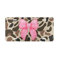 a pink bow on leopard print license plate