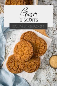 ginger biscuits on a white plate next to a cup of coffee and spoon