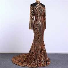 Stunning piece of embroidery, thousands of orangy gold sequins embroidered on black tulle to form this intricate design. This fabric is suitable for a stunning outfit to impress. Width is 140cm. Price is for one meter. Orders over one meter will be a continuous length of fabric. Black Fitted Sequin Dress For Wedding, Elegant Black Glitter Evening Dress, Glamorous Black Glitter Evening Dress, Glamorous Gold Sparkling Evening Dress, Black Embellished Sequin Fabric For Prom, Embellished Black Sequin Fabric For Prom, Black Sequin Dress For Wedding With Contrast Sequins, Black Wedding Dress With Contrast Sequin, Gold Sequin Dress With Contrast Detail For Wedding