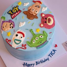 a birthday cake with cartoon characters on it