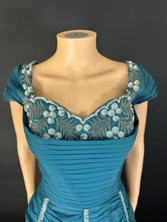 Stunning 1940s Georgette evening dress in a standing condition with beautiful bead and sequin encrusted bodies and pick up detail on the skirt. It's fully lined and the bodies itself structured with bones to give a glorious cinched in shape. An absolute belter of a dress and in wonderful Peacock blue. it fastens with a centre back zip and it has been dry cleaned. Bust 34 inches Waist 25 inches Waist to him 44 inches Beaded Floor-length Evening Dress With Fitted Bodice, Evening Gown With Beaded Fitted Bodice, Floor-length Beaded Evening Dress With Fitted Bodice, Beaded Evening Dress With Fitted Bodice For Gala, Beaded Fitted Evening Gown, Corset Fashion, Fancy Outfits, Dress Clothes For Women, Set Dress