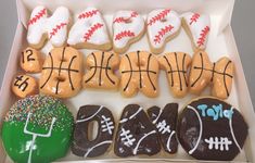 a box filled with lots of decorated doughnuts