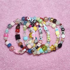 ♥ Please note Due to their handmade nature, these accessories will vary from piece to piece. I take artistic liberties with each bracelet and these designs are randomized, so you may not receive EXACT bead pattern as the listing photo. Same color pallets will be used. What does this mean?: https://www.instagram.com/p/CuzcjNUL1wb/ ♥ Sizing To know which length to choose, measure around your wrist with a tape measure. I'd recommend rounding UP to the nearest inch to ensure a comfortable fit. If yo Adjustable Letter Beads Jewelry For Crafting, Everyday Bohemian Personalized Beaded Bracelets, Customized Multicolor Jewelry For Everyday, Whimsical Beaded Bracelets As A Gift, Whimsical Handmade Bracelets For Gifts, Handmade Cute Beaded Bracelets For Everyday, Handmade Whimsical Bracelets As Gift, Bohemian Stretch Bracelet For Jewelry Making With Letter Beads, Handmade Whimsical White Beaded Bracelets