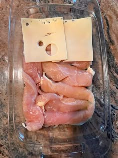 some meat and cheese in a plastic container