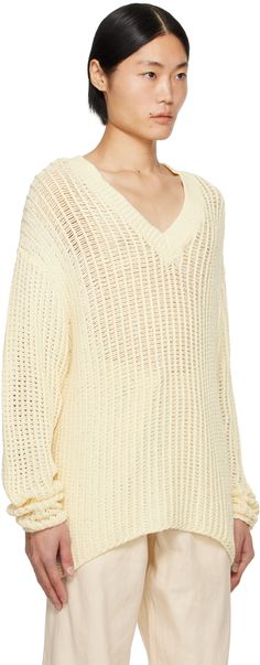 Knit cotton sweater. · Rib knit V-neck · Dropped shoulders Supplier color: Off-white White Knitted V-neck Sweater For Spring, White Knit V-neck Sweater, White V-neck Knit Sweater, Cotton V-neck Sweater With Pointelle Knit, Cream Textured Knit V-neck Sweater, Cream Knitted V-neck Sweater, Cream V-neck Knitted Sweater, Cream Cotton V-neck Sweater, Knit Cotton