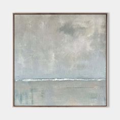 an abstract painting in grey and white with water on the horizon, framed against a gray wall