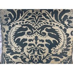 a black and white pillow with an intricate design