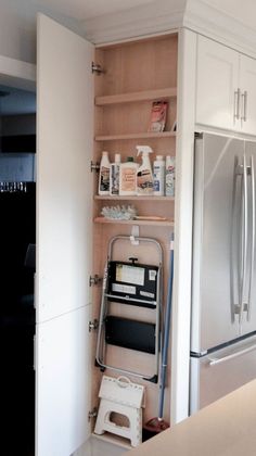 the kitchen is clean and ready to be used as a storage area for cleaning supplies