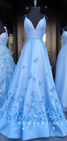 Blue Spring Gown With Sweetheart Neckline, Blue Gown With Sweetheart Neckline For Spring, Blue Spaghetti Strap Dress For Wedding, Light Blue Spaghetti Strap Wedding Dress, Blue Strapless Spring Gown, Blue Strapless Gown For Spring, Prom Dresses With Flowers, Dresses With Flowers, Blue Long Prom Dresses