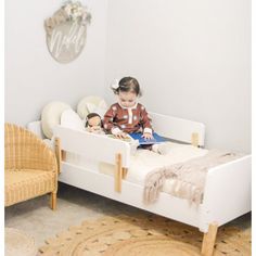 "A sturdy bed built just for toddlers with playful curves and modern shapes to smooth the meaningful transition into “a real bed.” The low profile and two removable rails provide a safe and comfortable sleeping place that helps your active toddler easily get in and out of bed. This high-quality bed fits a standard crib mattress and brightens any decor with a pop of modern design. " dadada Bed Frame Color: White/Natural | dadada Muse 19.49 H x 31.0 W x 55.0 D in white / brown in White / Natural | Nursing Pillows, Toddler Beds, Modern Shapes, High Quality Bedding, Crib Mattress, Toddler Room, Baby Safe, Quality Bedding, White Bedding