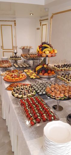 a buffet table filled with lots of food