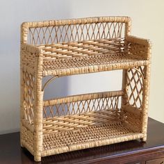 two wicker baskets sitting on top of a wooden table