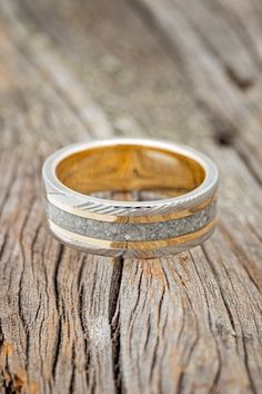 two tone gold and silver wedding ring on wood