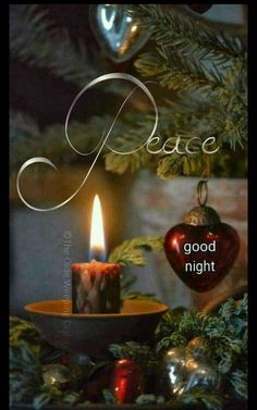 an image of a candle with the words peace and good night written on it next to some ornaments