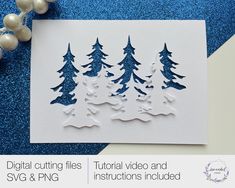 a card with some cut outs on it and christmas trees in the background, surrounded by ornaments