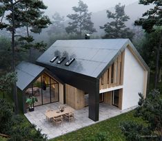 an aerial view of a house in the woods