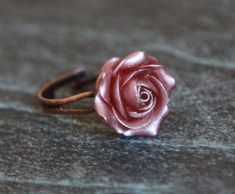 Cocktail adjustable ring with handmade flower. The dusty rose with metallic effect. Material of flower - polymer clay Floral ring with sculpted flower EACH PETAL MADE BY HAND Dia rose about 15 mm/ 0,59 inch The base in copper color is adjustable 6- 7.5 size/ 16.5-18 mm OLD ROSE CHOKER- https://www.etsy.com/listing/877806432 OLD ROSE PENDANT NECKLACE- https://www.etsy.com/listing/754345428 MINIMALIST OLD ROSE SET JEWELRY - https://www.etsy.com/listing/784335100 If you like this item you can visit Adjustable Rose Design Rose Gold Ring, Adjustable Copper Flower Jewelry, Adjustable Pink Flower Ring For Anniversary, Pink Rose Design Ring For Gift, Pink Rose Design Flower Ring, Pink Flower Ring With Rose Design, Adjustable Rose Design Flower Ring As Gift, Rose Gold Jewelry With 3d Flowers For Gift, Adjustable Pink Copper Jewelry