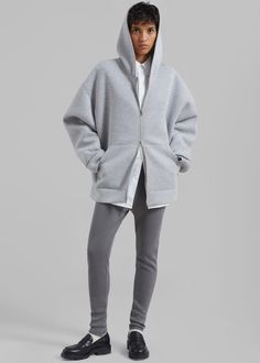 Color: Grey Midweight cotton blend fabric Oversized silhouette Exaggerated hood Drop shoulders Large front pockets Two-way zip front closure Unlined 50% Cotton 50% Rayon Dry Clean By The Frankie Shop. Imported Oversized Hooded Jacket For Loungewear Athleisure, Hooded Cotton Outerwear With Zip Cuffs, Relaxed Fit Hoodie Outerwear With Pockets, Athleisure Hoodie Outerwear With Zipper, Athleisure Hoodie With Zipper Closure, Oversized Gray Cotton Hooded Jacket, Oversized Hooded Jacket With Ribbed Cuffs For Loungewear, Oversized Cotton Hooded Jacket In Athleisure Style, Cozy Oversized Outerwear With Zipper Closure