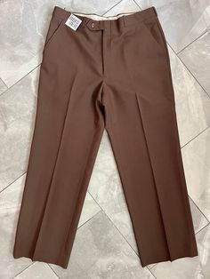 "Vintage dad-pant trousers made by Boulevard Club. Lovely neutral brown colour. 100% wool. Tag does not indicate size, measures 16\" across waist, 20\" hips, 11\" rise, 28\" inseam, 9.5\" leg opening." Tailored Brown Bottoms For Work, Brown Straight Leg Dress Pants With Pockets, Tailored Brown Bottoms With Tapered Leg, Brown Tailored Tapered Leg Bottoms, Classic Straight Leg Brown Pants, Fitted Brown Work Pants With Pockets, Classic Brown Straight Leg Pants, Brown Straight Leg Pants With Welt Pockets, Classic Brown Tapered Leg Bottoms