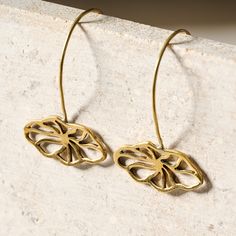 Elevate any look with these delicate floral drop earrings! Made from recycled bombshell brass - an amazing detail to share - these gorgeous golden-hued earrings are quick to slip on and add an elegant touch to any outfit. A Ten Thousand Villages Exclusive handcrafted by artisans with Rajana Association of Cambodia, which supports income generation and skills training, producing fair trade products using traditional Cambodian skills with contemporary design. Chain Scarf, Candle Wall Decor, Ten Thousand, Cuff Rings, Accessories Bags Purses, Tea Accessories, Accessories Storage, Corporate Gifts, Earring Necklace