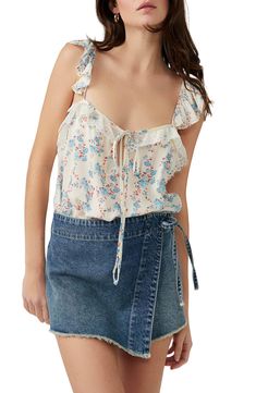 This flowery tank bodysuit is designed with soft ruffles and lovely lace. V-neck Adjustable straps 100% viscose with 95% polyamide, 5% elastane Machine wash, dry flat Imported Spring Lace Camisole With Floral Print, Feminine Camisole With Tie Straps For Spring, Summer Tank Top With Lace Trim And Ruffled Straps, Spring Feminine Camisole With Ruffled Straps, Feminine Spring Camisole With Ruffled Straps, Spring Floral Print Tank Top With Ruffled Straps, Summer Lace Camisole For Brunch, Spring Floral Tank Top With Ruffled Straps, Summer Floral Print Tank Top With Ruffled Straps