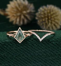 an image of two rings with diamonds on top and one ring in the shape of a triangle