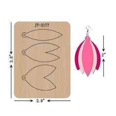 a pair of wooden earrings is shown with measurements