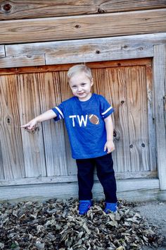 This is a custom first birthday football shirt for your baseball fan! This shirt is made to order we can customize the numbers and your child's name! The royal blue is the shirt pictured. Please add age and name (in all lowercase letters) to comments to seller when checking out Please note the navy (denim) color is not a true navy and can look almost dark grey in some lighting. **Please check shop announcement for current production times! Birthday Football, 2nd Birthday Shirt, Football Birthday Party, Football Birthday, Birthday Boy Shirts, Boys Graphic Tee, Denim Color, Baseball Fan, The Numbers