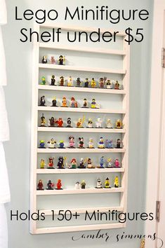 a white shelf filled with small toy figurines on top of it's sides